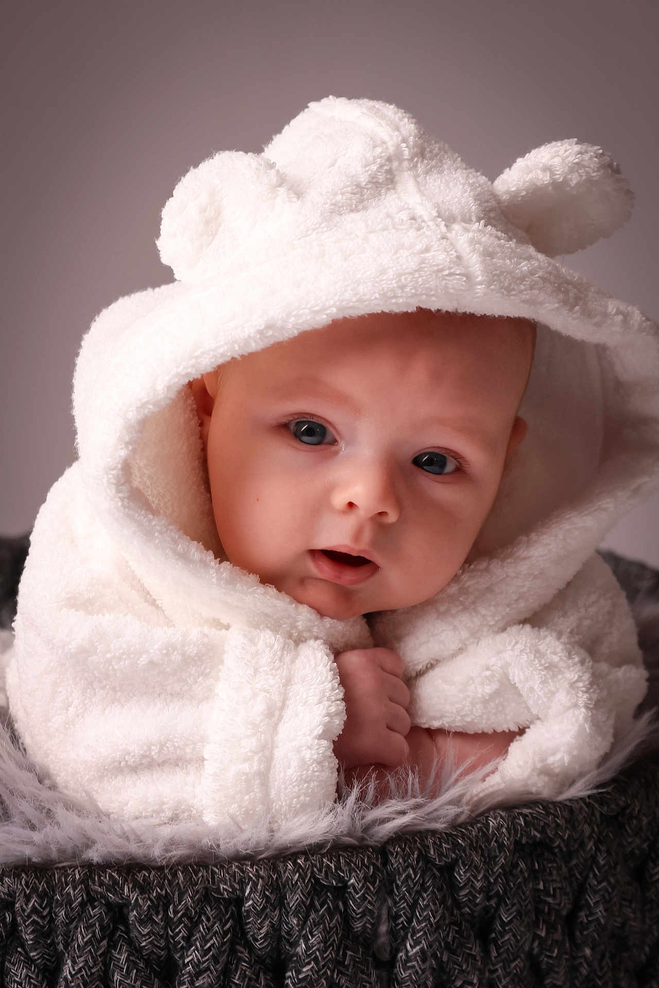 Hugo is registered to the contest to win money with this photo: baby, infant, face, hood, towel, white, soft, cute, closeup, portrait, skin, eyes, expression, blanket, texture, warm, cozy, child, newborn, cuddly