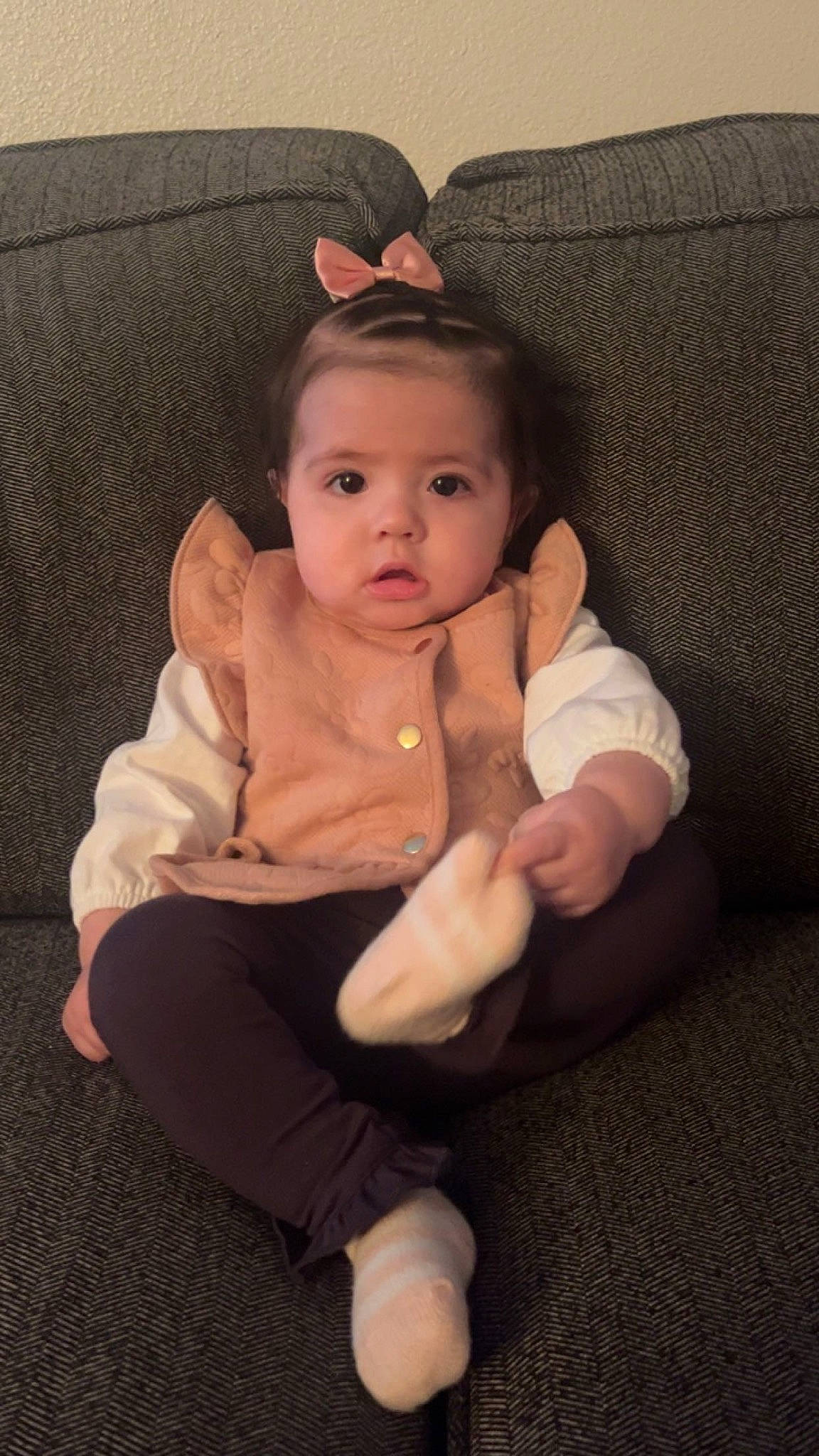 Alayah joined the competition — help win amazing prizes! baby, baby_toddler_clothing, cheek, child, comfort, couch, eye, flooring, foot, head, human_leg, lap, linens, person, sitting, skin, sleeve, sock, thumb, toddler