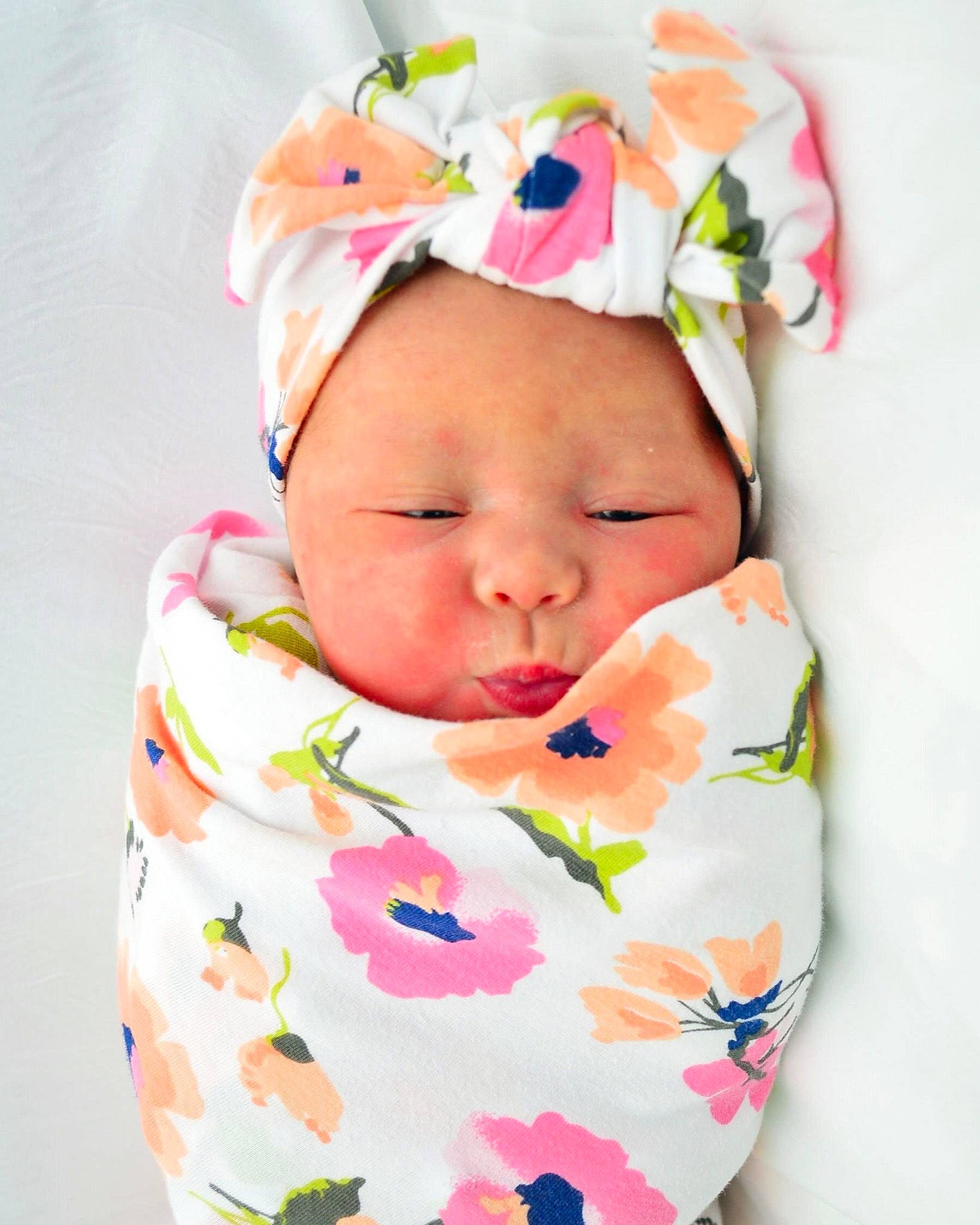 Presley is registered to the contest to win money with this photo: baby, baby_products, baby_sleeping, baby_toddler_clothing, child, fashion_accessory, hair_accessory, head, headband, headgear, pattern, person, pink, product, textile, toddler