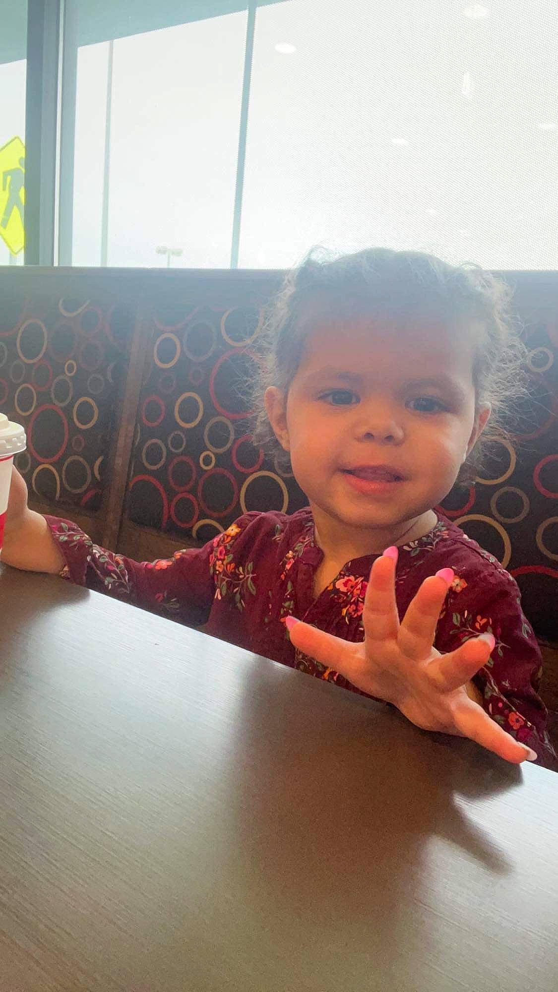 Penelope joined the competition — help win amazing prizes! baby, child, cup, drinkware, finger, flooring, fun, happy, lip, nose, person, serveware, sitting, skin, smile, table, tableware, thumb, toddler, window