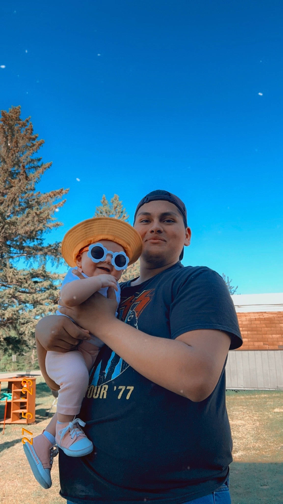 Paisley is registered to the contest to win money with this photo: blue, electric_blue, event, eyewear, fawn, fun, gesture, happy, hat, headwear, landscape, leisure, person, recreation, shorts, sky, stuffed_toy, t_shirt, tourism, travel