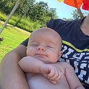Bodhi joined the competition — help win amazing prizes! baby, infant, arm, person, umbrella, rainbow, outdoor, nature, greenery, sunlight, smile, shirt, tshirt, skin, hand, holding, relaxing, daylight, portrait, peaceful