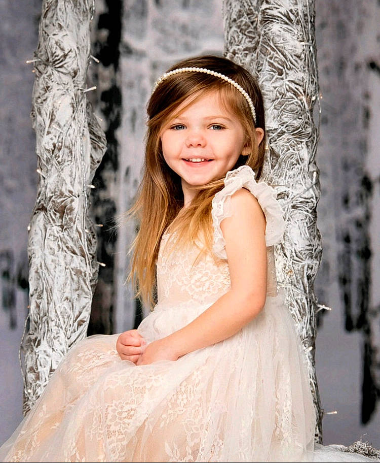 Marleigh is registered to the contest to win money with this photo: bridal_clothing, bridal_party_dress, clothing, dress, eye, fashion, flash_photography, hair, happy, human_body, iris, joy, people_in_nature, person, plant, smile, tree, trunk, twig, wedding_dress