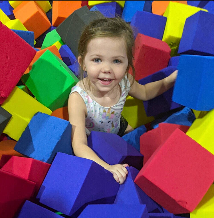 Marleigh is registered to the contest to win money with this photo: baby_toddler_clothing, child, design, dress, electric_blue, event, facial_expression, fun, happy, joy, leisure, magenta, pattern, person, play, product, recreation, red, room, smile