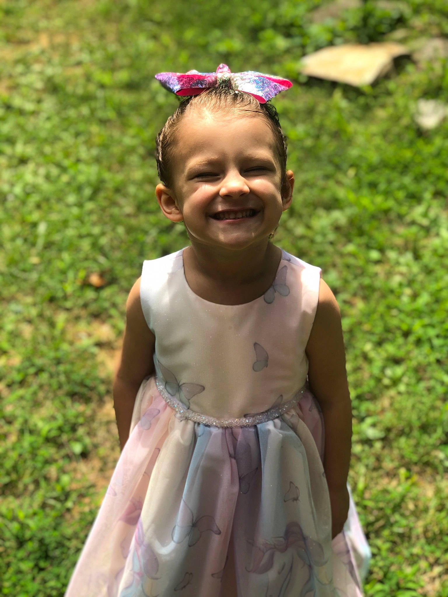 Aubree is registered to the contest to win money with this photo: baby_toddler_clothing, child, day_dress, dress, embellishment, facial_expression, hair_accessory, happy, headband, headpiece, joy, one_piece_garment, people_in_nature, person, pink, purple, spring, summer, toddler