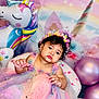 baby, child, dress, tulle, headband, flower_crown, chair, unicorn, balloon, pink, purple, pastel_colors, star_pattern, curly_hair, indoors, celebration, portrait, cute, decorations, festive