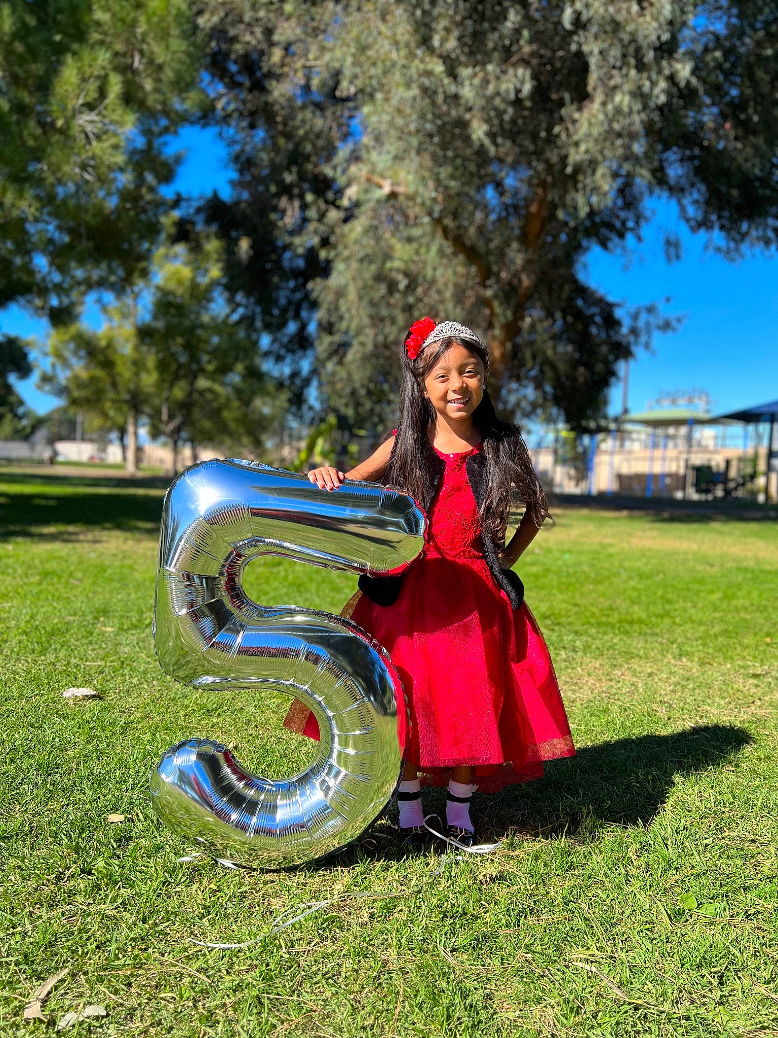 Sophia joined the competition — help win amazing prizes! automotive_tire, automotive_wheel_system, electric_blue, event, fun, grass, happy, headwear, joy, lawn, leisure, musical_instrument, people_in_nature, person, plant, python, reptile, serpent, sky, smile