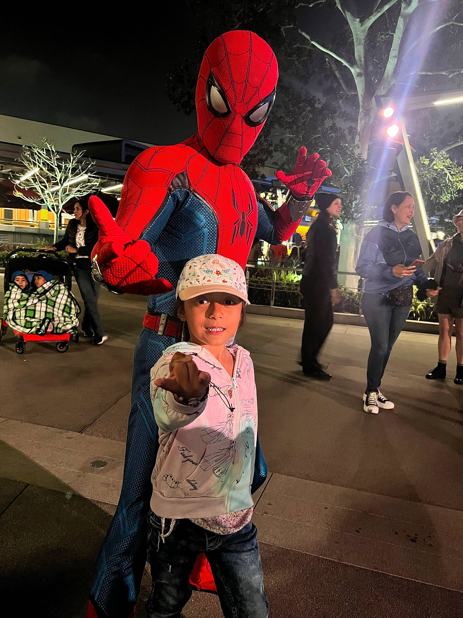 Sophia joined the competition — help win amazing prizes! carmine, city, cool, crowd, event, fictional_character, fun, happy, hat, headwear, interaction, leisure, magenta, pedestrian, person, recreation, road, street, t_shirt, toddler