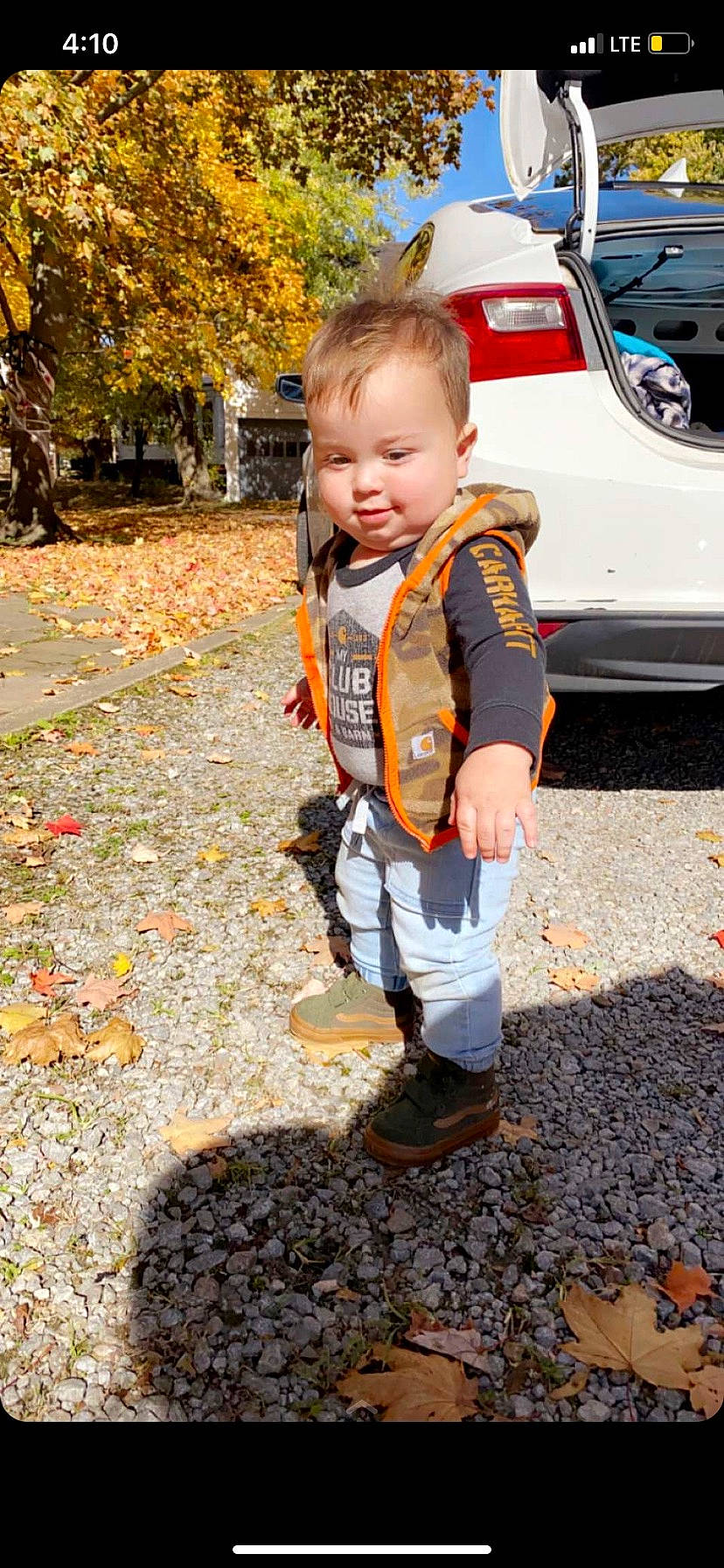 Braxton is registered to the contest to win money with this photo: automotive_design, automotive_exterior, automotive_lighting, bumper, car, child, fun, grass, leaf, leisure, motor_vehicle, people, people_in_nature, person, plant, smile, toddler, tree, vehicle, vehicle_door