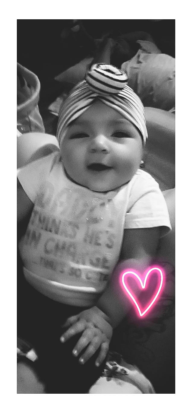 Noelle is registered to the contest to win money with this photo: baby, baby_toddler_clothing, black, black_and_white, cap, cheek, gesture, happy, headwear, human_body, monochrome_photography, organ, people, person, photograph, product, sleeve, smile, standing, style