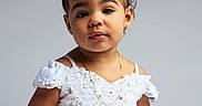 Brianna is registered to the contest to win money with this photo: bow, bracelet, child, curly_hair, cute, fashion, girl, happy, innocent, jewelry, necklace, person, photography, portrait, pose, smiling, studio, toddler, white_dress, young