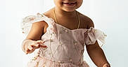 Brianna joined the competition — help win amazing prizes! toddler, child, dress, pink, hair_bows, smiling, portrait, cute, happy, girl, flower_embroidery, gold_necklace, studio, light_background, arms_outstretched, curly_hair, fashion, innocence, young_child, playful