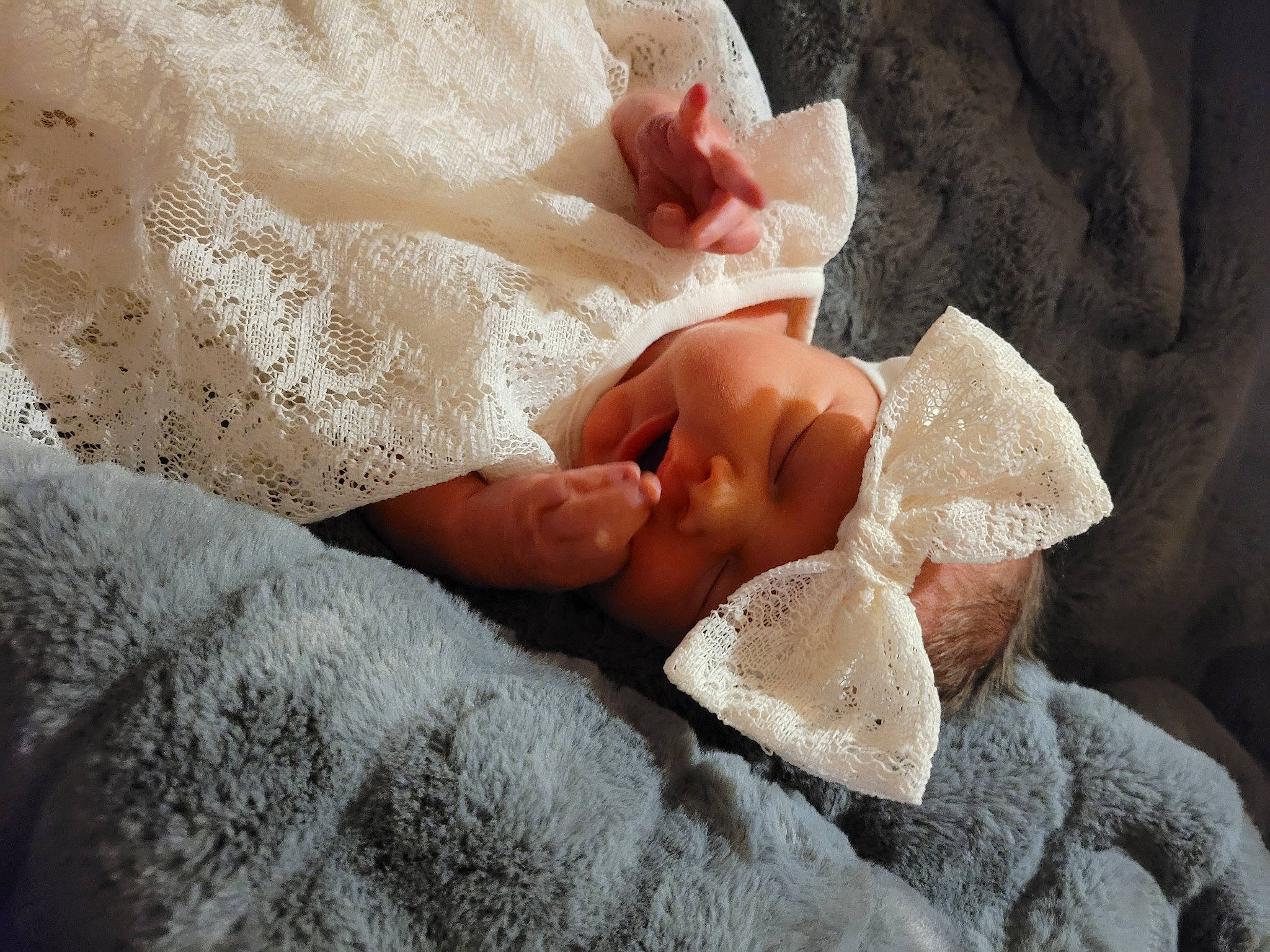 Lilyann joined the competition — help win amazing prizes! baby, baby_toddler_clothing, close_up, comfort, dress, embellishment, fashion_accessory, finger, foot, gesture, headgear, headwear, human_body, linens, nail, person, petal, skin, sleeve, thumb