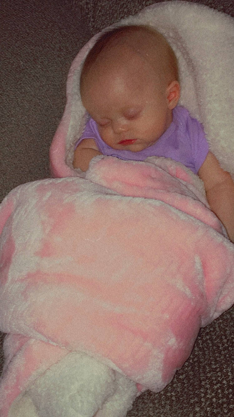 Valeria is registered to the contest to win money with this photo: baby, baby_sleeping, baby_toddler_clothing, cheek, chin, comfort, eye, eyebrow, face, hand, head, human_body, iris, lip, mouth, neck, nose, person, pink, skin