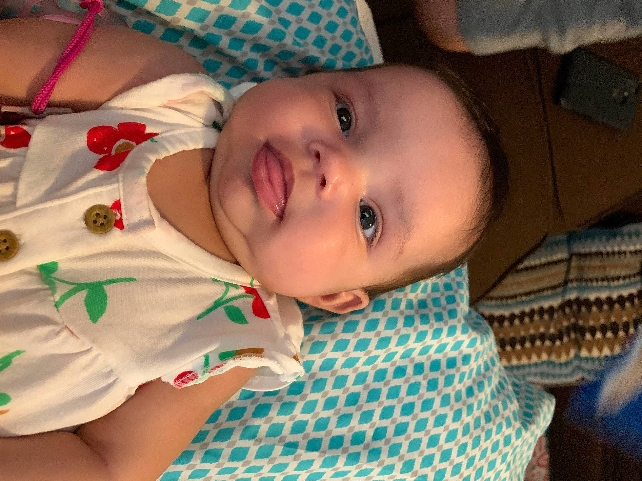 Madison is registered to the contest to win money with this photo: baby, baby_toddler_clothing, cheek, child, comfort, eye, fun, happy, head, iris, lip, mouth, nose, pattern, person, room, skin, sleeve, smile, toddler