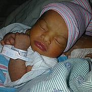 Xalori joined the competition — help win amazing prizes! baby, bed, blanket, closeup, cute, face, hand, hat, hospital, hospital_id, infant, newborn, newborn_baby, peaceful, person, resting, skin, sleeping, striped, swaddled