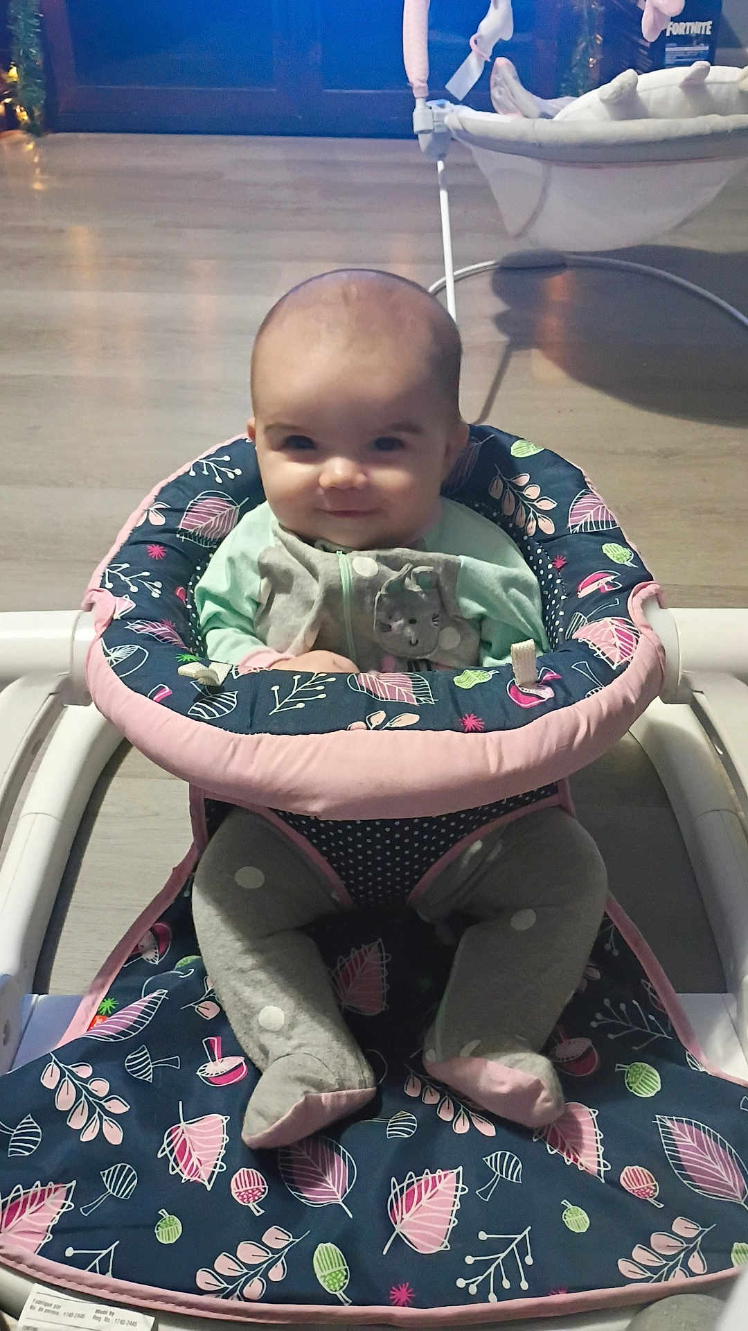 Octavia is registered to the contest to win money with this photo: baby, infant, walker, smiling, indoor, floor, clothing, seat, child, cute, pattern, legs, footwear, toy, furniture, person, playtime, happy, home, young