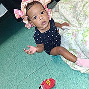 Ny'Syish joined the competition — help win amazing prizes! baby, infant, child, portrait, curious, looking_at_camera, bonnet, pink_bonnet, polka_dot_outfit, sitting, indoors, blanket, floor, tile_floor, pink_socks, red_shoe, clothing, black_jacket, home, photography