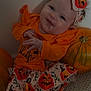Priscilla joined the competition — help win amazing prizes! baby, infant, halloween, pumpkin, orange_clothing, headband, smile, cute, festive, holiday, costume, sitting, wall, carpet, child, portrait, indoors, toddler, young_child, celebration
