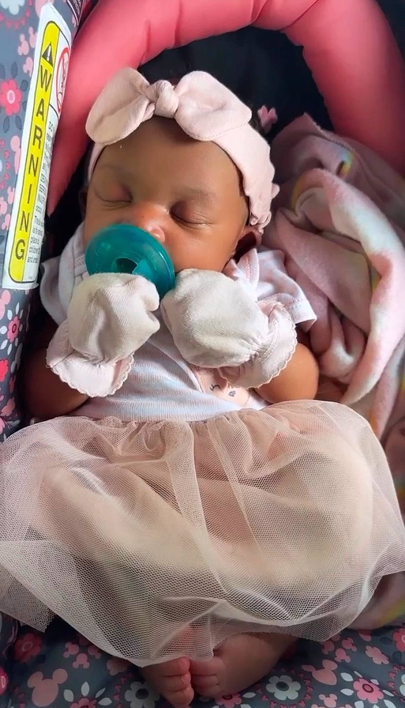 Adrienne is registered to the contest to win money with this photo: baby, baby_products, baby_safety, baby_sleeping, baby_toddler_clothing, bedding, bedtime, blanket, cheek, child, comfort, event, infant_bed, linens, nap, peach, person, pink, room, sleep