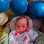 baby, balloons, blanket, blue_balloons, celebration, child, colorful, cozy, cream_balloon, cute, face, gold_balloon, hand, indoor, infant, newborn, pajamas, portrait, smiling, soft