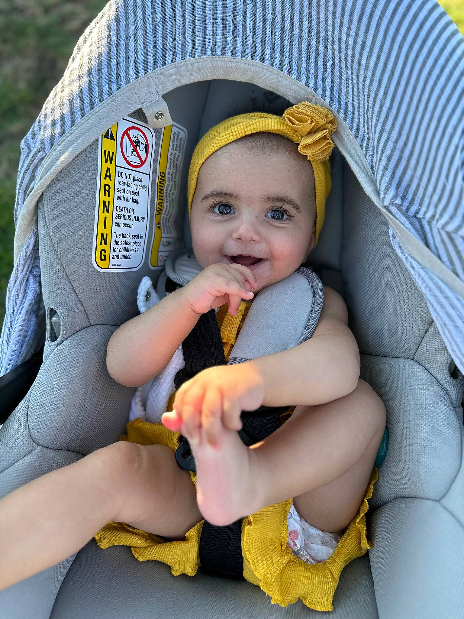 Ariana is registered to the contest to win money with this photo: baby, baby_carriage, baby_in_car_seat, baby_products, baby_toddler_clothing, car_seat, child, comfort, finger, fun, happy, lap, leisure, person, sitting, skin, smile, thigh, thumb, toddler