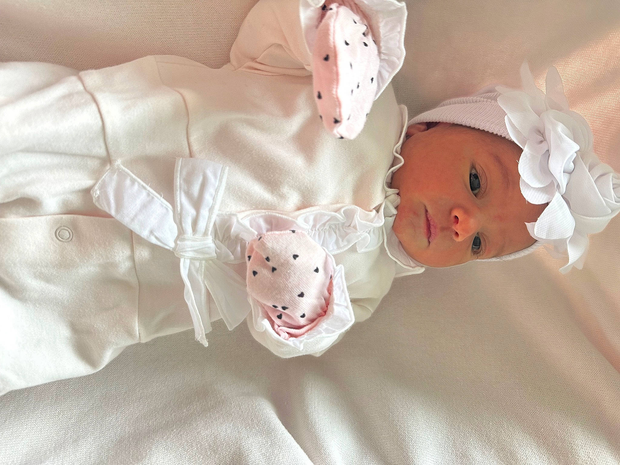Ariana is registered to the contest to win money with this photo: baby, baby_products, baby_sleeping, baby_toddler_clothing, baby_toys, bed_sheet, bedding, child, comfort, headwear, linens, pattern, peach, person, pink, room, skin, sleeve, stuffed_toy, textile