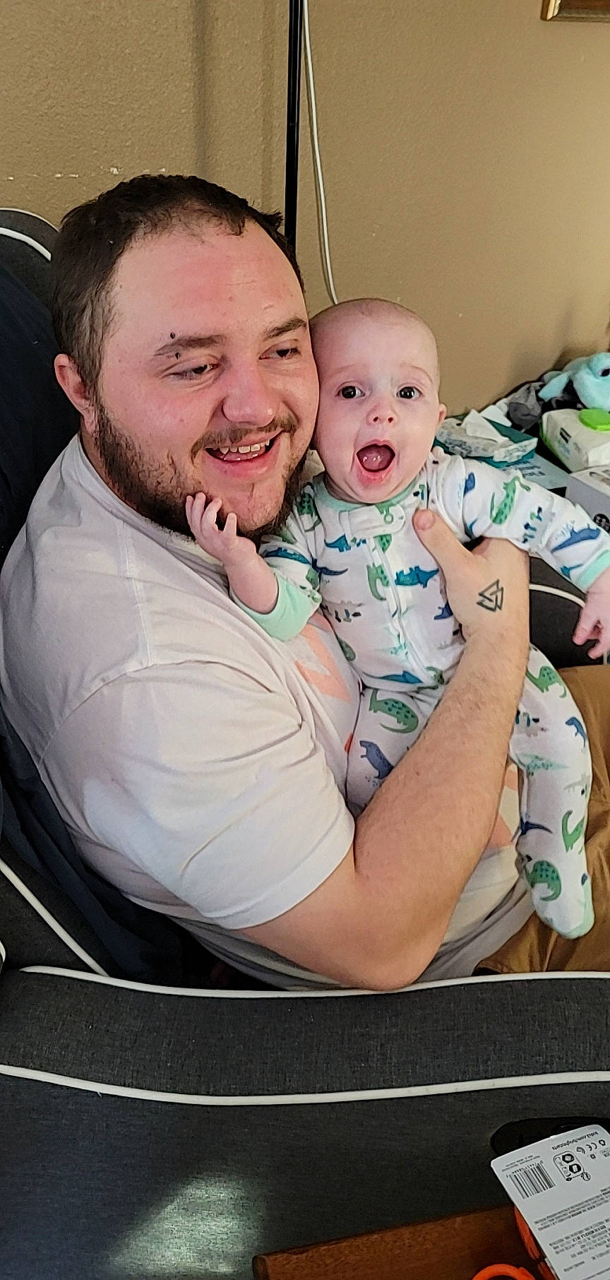 Noah is registered to the contest to win money with this photo: abdomen, baby, baby_toddler_clothing, beard, cheek, child, comfort, event, eye, face, fun, happy, head, joy, love, mouth, person, sitting, skin, smile