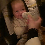 Nina joined the competition — help win amazing prizes! baby, blanket, bottle, care, child, closeup, clothing, comfort, family, feeding, hand, happy, indoors, infant, nurture, person, portrait, seat, smile, warm