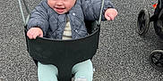 Nina joined the competition — help win amazing prizes! baby, infant, child, swing, playground, beanie, smile, puffy_jacket, booties, mittens, stroller, asphalt, concrete_wall, chain, swing_seat, hands, outdoors, cold_weather, happy, cute