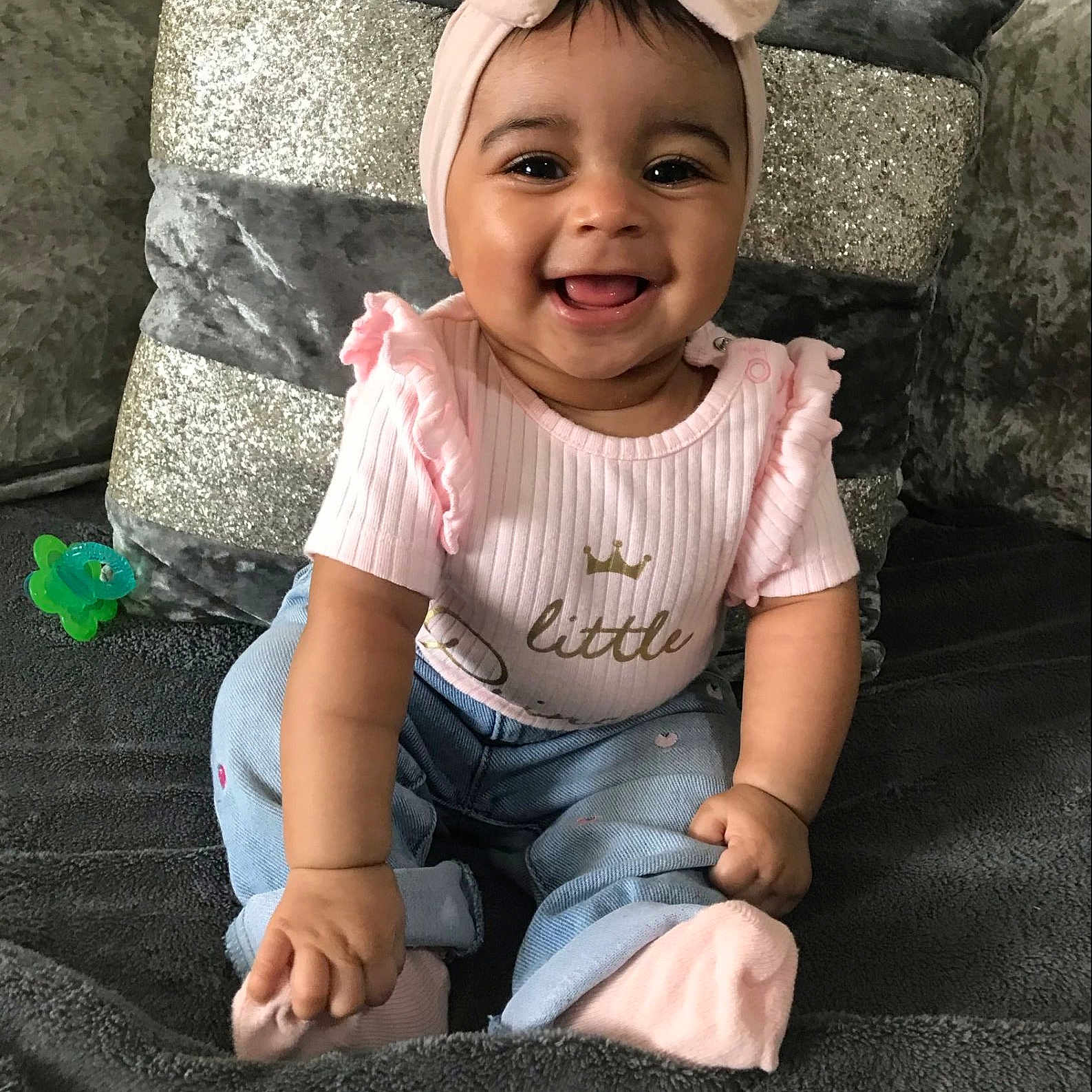 Zvayah Amor joined the competition — help win amazing prizes! accessories, baby, babylaughing, clothing, cushion, face, happy, hat, head, jeans, jewelry, laughing, necklace, pants, person, photography, portrait, sitting, smile, t_shirt