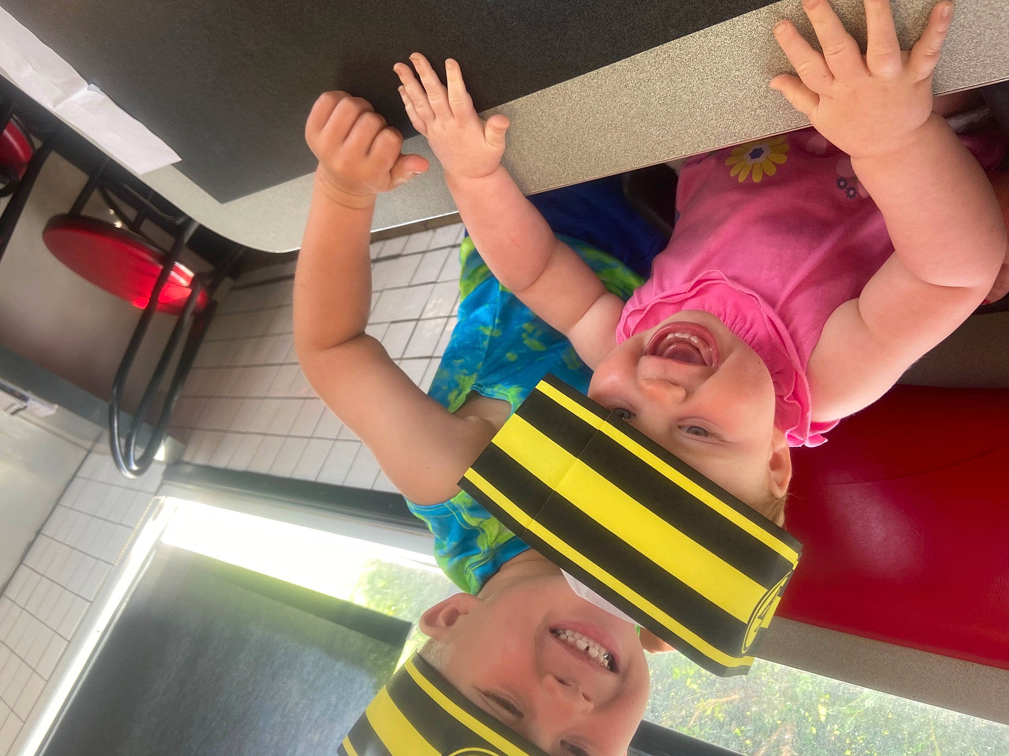 Gracelyn is registered to the contest to win money with this photo: baby_toddler_clothing, child, elbow, event, finger, fun, gesture, hand, happy, headwear, human_leg, joy, leisure, magenta, person, room, smile, t_shirt, thigh, thumb