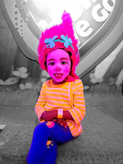 Kalia is registered to the contest to win money with this photo: child, costume, fashion_accessory, fun, hair_accessory, happy, headgear, magenta, person, photography, pink, plant, play, purple, smile, toddler, vacation, violet
