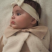 Milana participe au concours pour gagner de l'argent avec cette photo : baby, infant, headband, profile, face, clothing, beige, soft_texture, warm, cute, child, portrait, indoor, closeup, adorable, newborn, cozy, young, expression, gaze