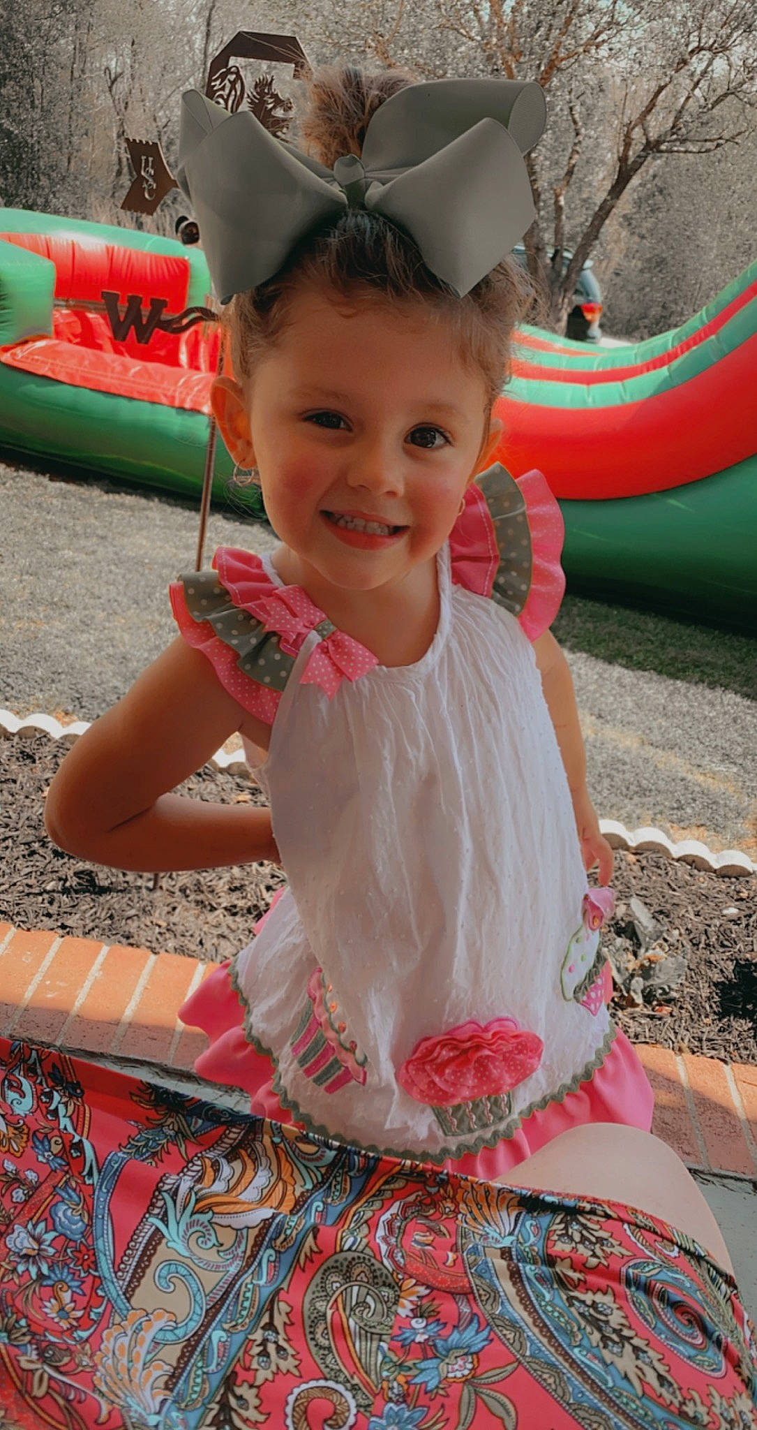 Addyson is registered to the contest to win money with this photo: baby_toddler_clothing, dress, eye, face, facial_expression, fun, green, happy, head, joy, leisure, organ, people, person, pink, recreation, red, skin, smile, summer