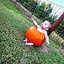 baby, pumpkin, grass, outdoor, child, fence, nature, relaxing, autumn, cute, peaceful, playful, barefoot, sitting, greenery, young_child, seasonal, holiday, fall, portrait
