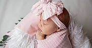 Kinsley joined the competition — help win amazing prizes! newborn, baby, pink_bow, headband, blanket, sleeping, infant, cushion, soft_texture, portrait, cute, child, wrapped, peaceful, resting, indoors, closeup, adorable, young, toddler