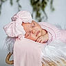 Kinsley is registered to the contest to win money with this photo: baby, sleeping, pink_bow, blanket, basket, fluffy, fur, soft, portrait, newborn, cute, peaceful, child, headwear, cozy, indoor, decor, rest, adorable, infant