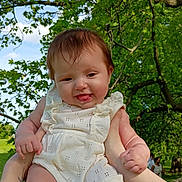 Violet joined the competition — help win amazing prizes! baby, child, outdoor, nature, tree, greenery, sky, tattoo, arms, holding, romper, happy, smiling, infant, summer, playful, portrait, cute, person, sunlight