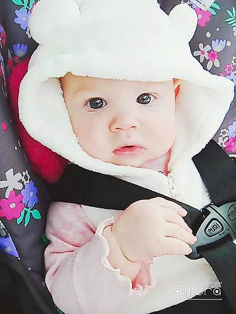 Colleen is registered to the contest to win money with this photo: baby, cheek, child, ear, hat, head, headgear, lip, person, pink, skin, toddler