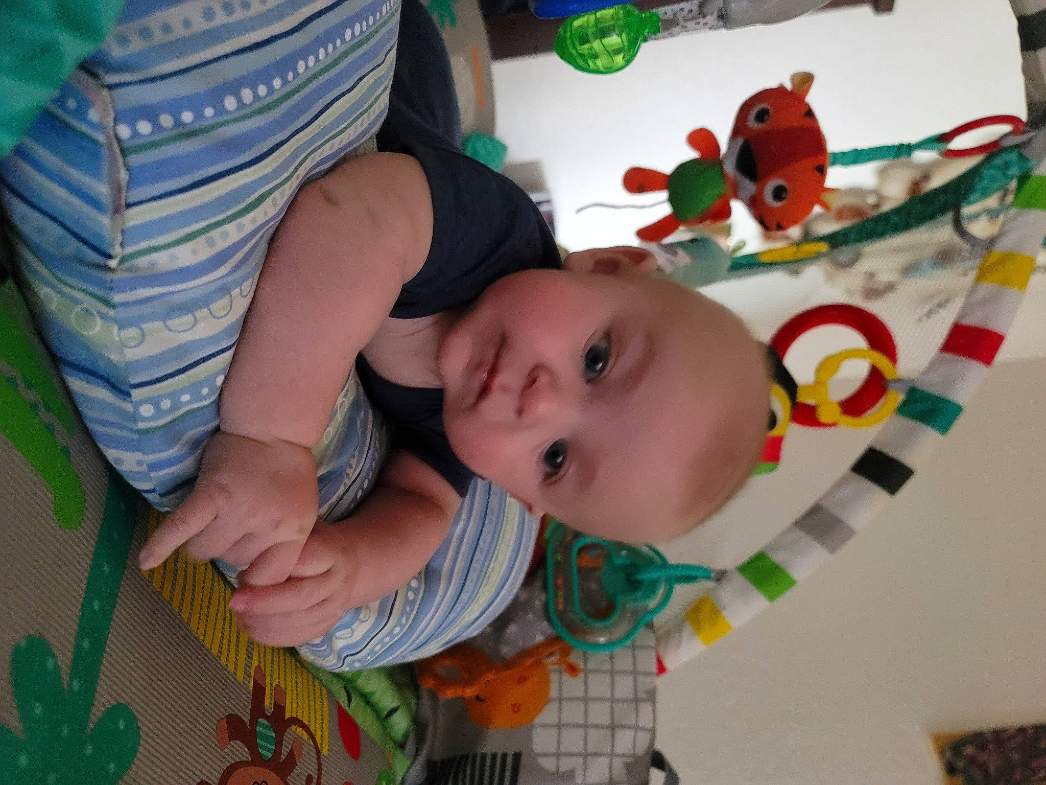 Wyatt joined the competition — help win amazing prizes! baby, baby_products, baby_toddler_clothing, baby_toys, cheek, child, flooring, fun, grass, green, happy, leaf, pattern, person, play, room, skin, smile, textile, toddler