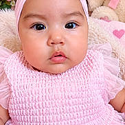 Eilany Campos is registered to the contest to win money with this photo: baby, child, infant, portrait, pink, dress, bow, headband, smiling, wide_eyed, face, indoors, floral, flowers, teddy_bear, stuffed_animal, nursery, closeup, fashion, cute