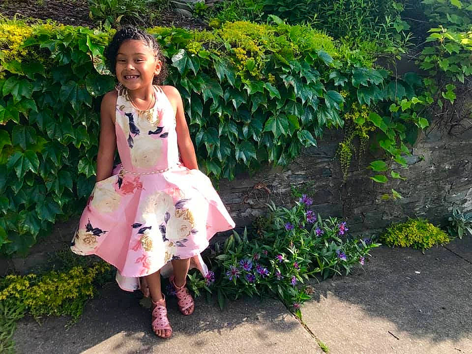 Seraphina joined the competition — help win amazing prizes! adaptation, botanical_garden, botany, child, dress, fawn, flower, garden, grass, joy, person, pink, plant, shoe, shrub, textile, vacation