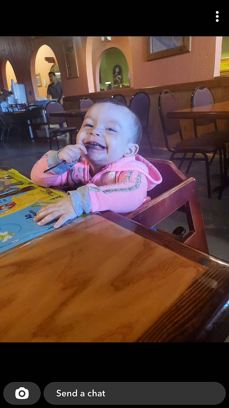 Jaylee is registered to the contest to win money with this photo: baby, chair, cheek, child, finger, floor, flooring, fun, furniture, happy, hardwood, joy, leisure, person, sitting, smile, table, tableware, toddler, varnish