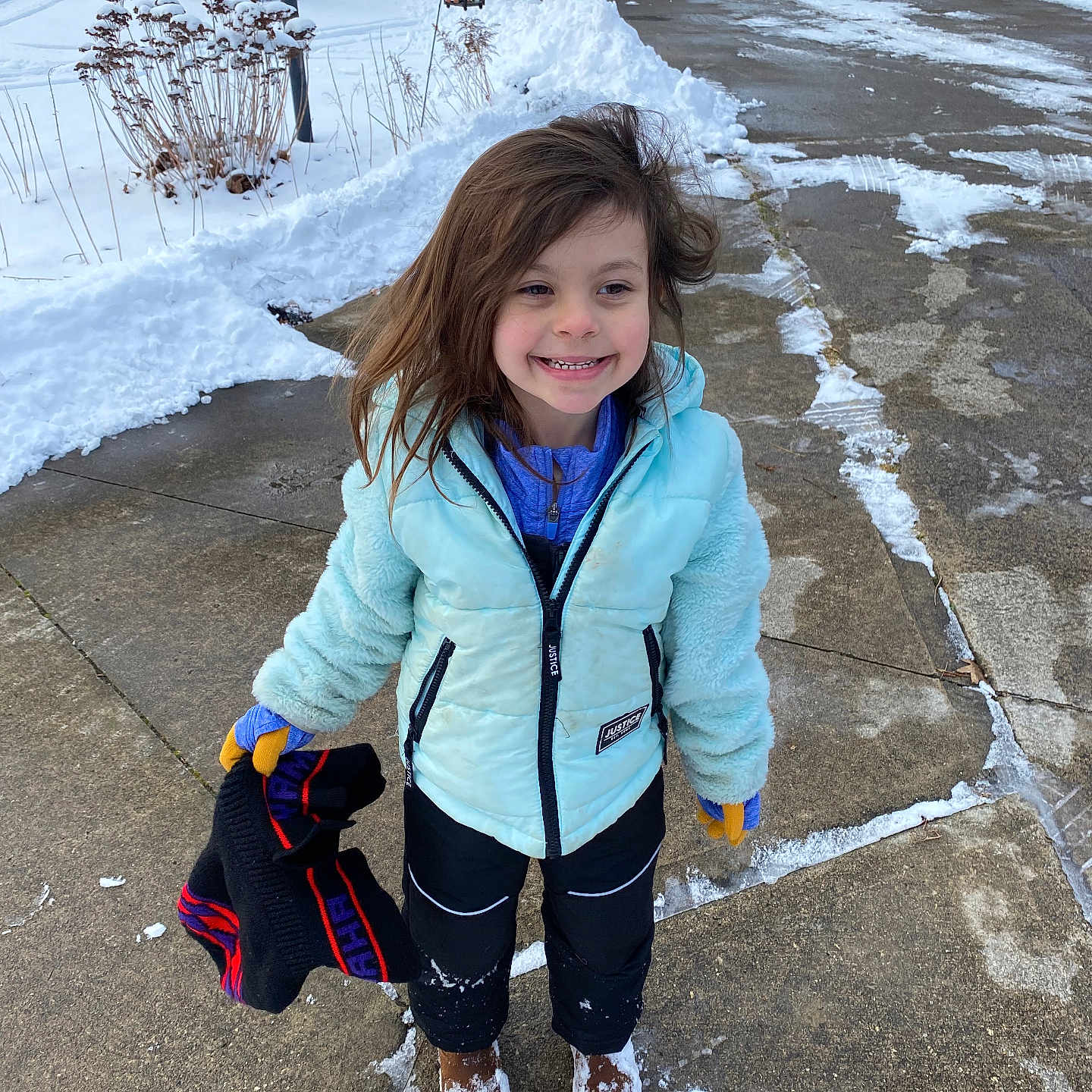 Jaylee joined the competition — help win amazing prizes! architecture, building, child, clothing, coat, face, female, footwear, girl, glove, head, jacket, outdoors, pants, path, person, photography, portrait, shelter, sidewalk
