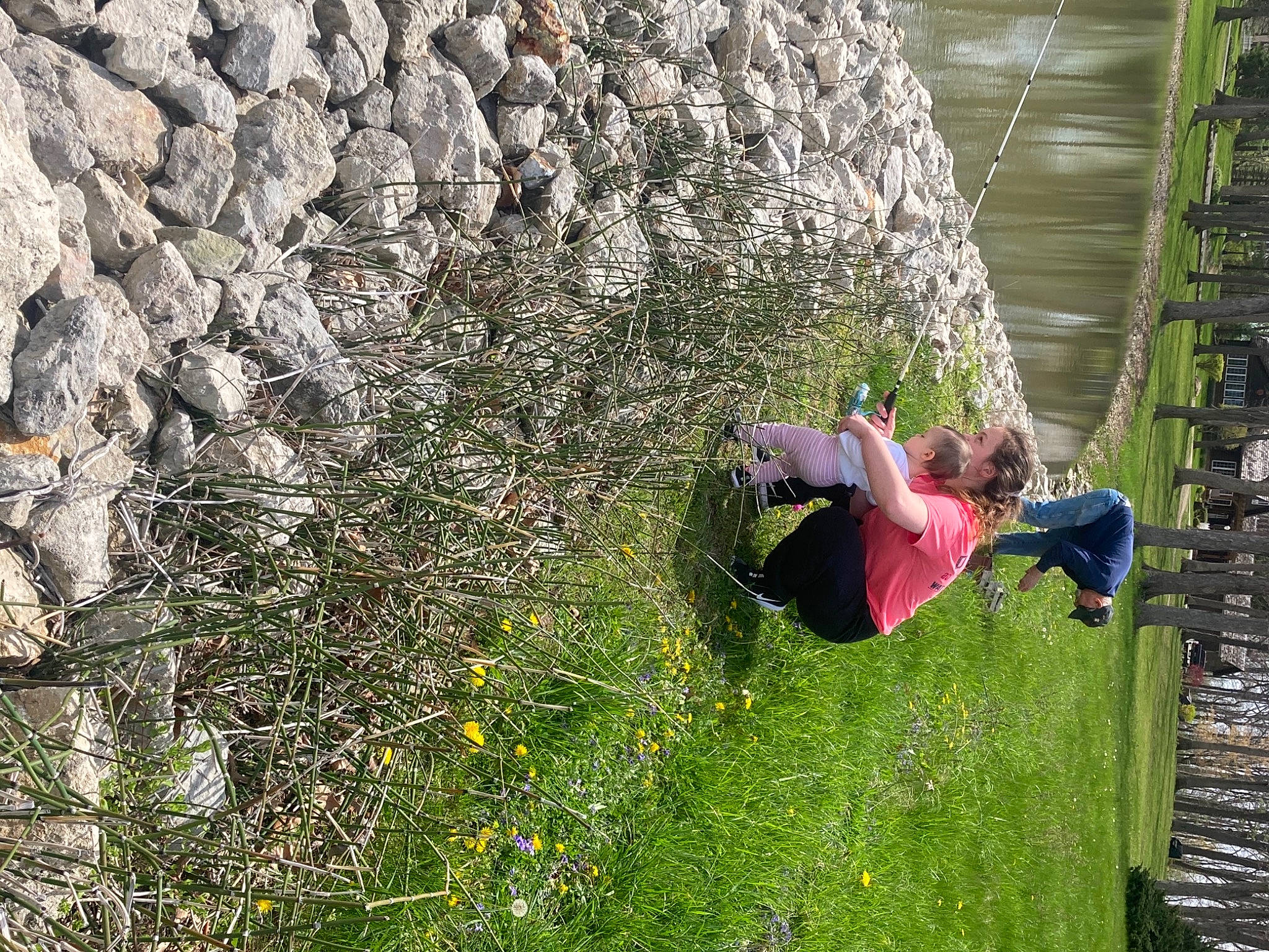 Jaylee is registered to the contest to win money with this photo: adventure, bedrock, climbing, extreme_sport, fun, grass, jungle, lake, landscape, leisure, people_in_nature, person, plant, recreation, rock, rock_climbing_equipment, rope, shrub, sport_climbing, tree