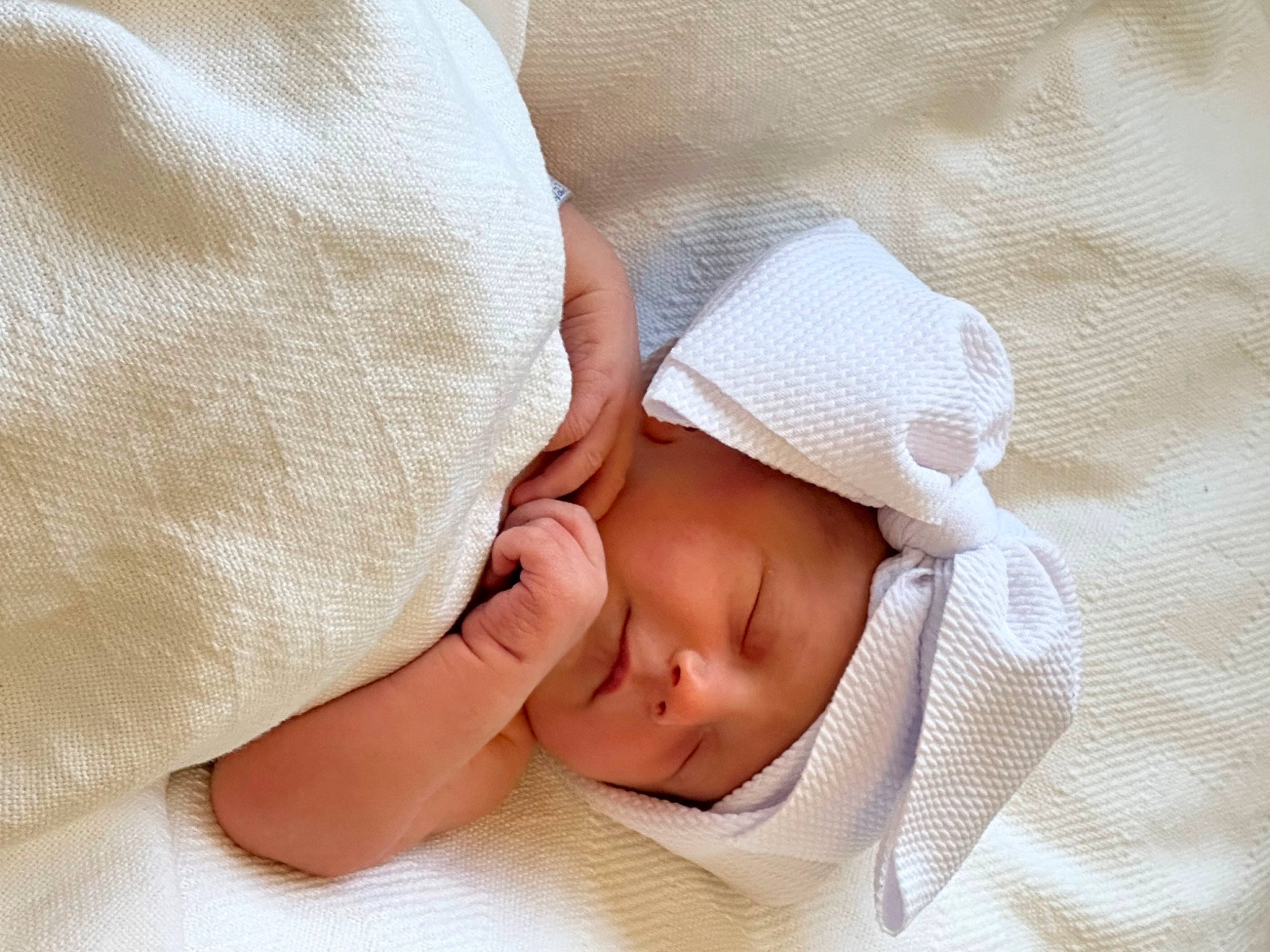 Aleia is registered to the contest to win money with this photo: baby, baby_products, baby_sleeping, baby_toddler_clothing, bedtime, child, comfort, fashion_accessory, gesture, headwear, linens, nail, pattern, peach, person, portrait_photography, sleep, sleeve, thumb, toddler