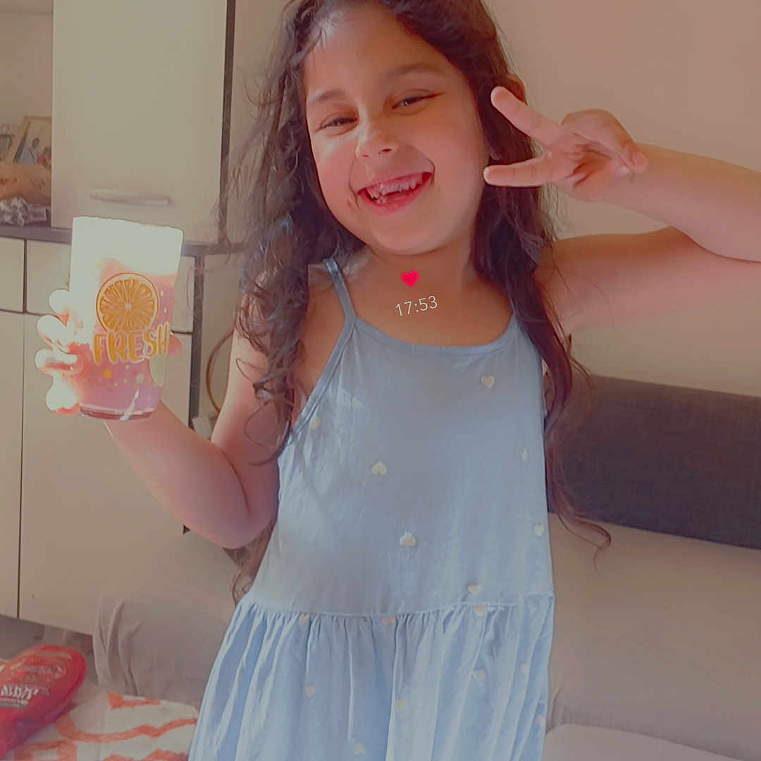 Elena participe au concours pour gagner de l'argent avec cette photo : beverage, bodypart, child, citrusfruit, clothing, dress, eveningdress, face, female, finger, formalwear, furniture, girl, hand, head, juice, person, photography, portrait, wood