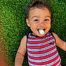 toddler, child, grass, outdoor, striped_clothing, smiling, happy, face, portrait, casual, playful, chalk, colorful, cute, young_child, summer, nature, relaxed, fun, person