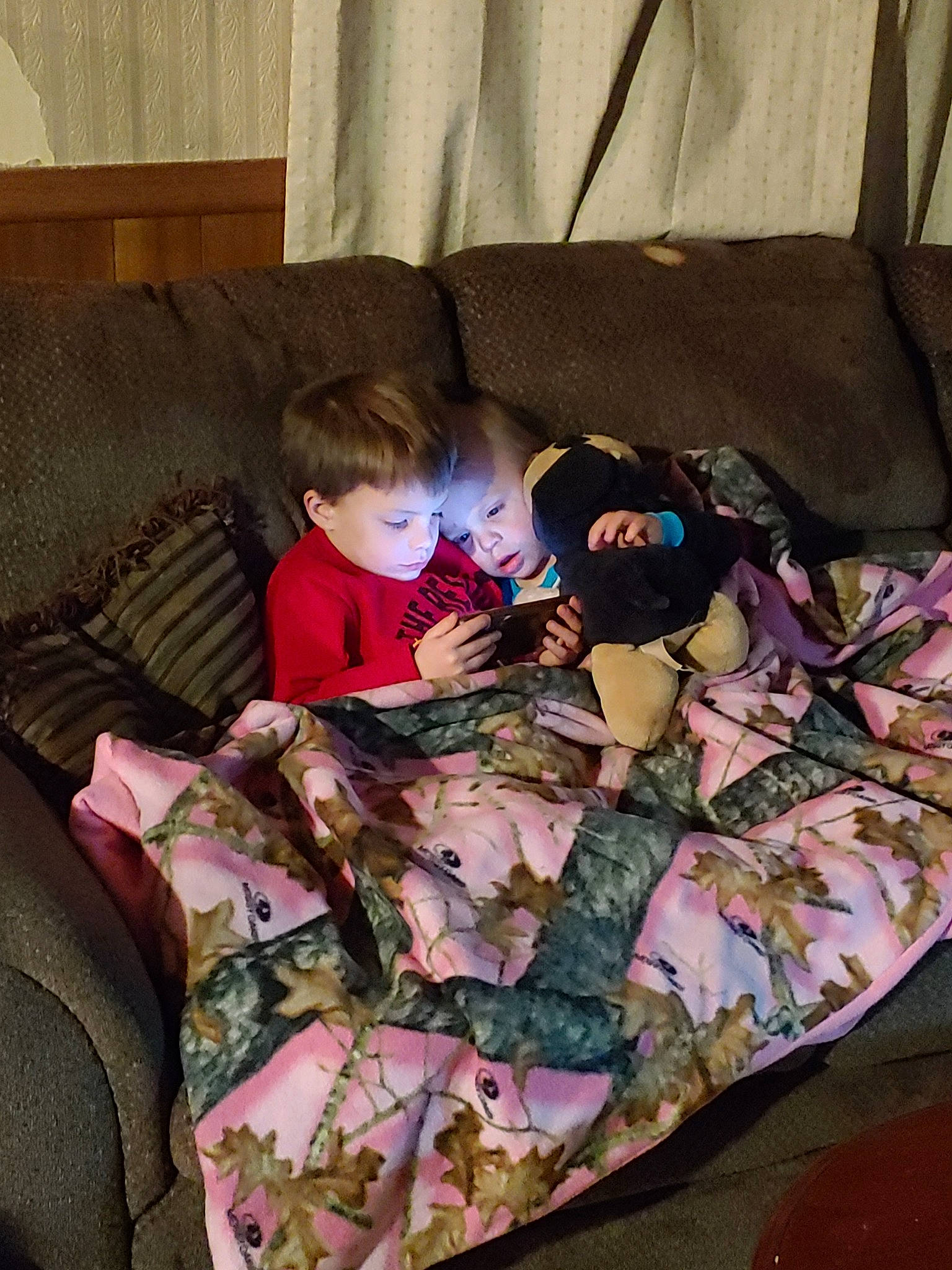 Joseph is registered to the contest to win money with this photo: bed, bed_sheet, bedtime, camouflage, child, linens, nap, pattern, person, sleep, textile, toddler